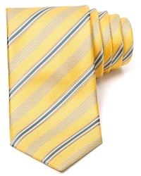 Fine stripes are neatly trimmed with a thin rope pattern for classic appeal on this handsome silk tie from Canali. Fine stripes are neatly trimmed with a thin rope pattern for classic appeal on this handsome silk tie from Canali.