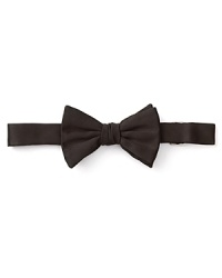 Rendered in lavish silk for an opulent finish to your tuxedo, this black bow tie is a modern man essential and comes pre-tied for effortless, no-fuss styling. Rendered in lavish silk for an opulent finish to your tuxedo, this black bow tie is a modern man essential and comes pre-tied for effortless, no-fuss styling.