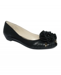 Hit the perfect note between casual and chic with the Jewelnote flats by Nine West. A leather flower tops off the ruched peep-toe silhouette. Hit the perfect note between casual and chic with the Jewelnote flats by Nine West. A leather flower tops off the ruched peep-toe silhouette.