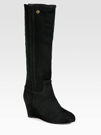 A covered wedge elevates this seasonal essential of ultra-rich suede, topped with signature goldtone hardware. Self-covered wedge, 3 (75mm)Shaft, 16½Leg circumference, 13½Suede upperBack zipLeather lining and solePadded insoleImportedThis style runs true to size. We recommend ordering your usual size for a standard fit. A covered wedge elevates this seasonal essential of ultra-rich suede, topped with signature goldtone hardware. Self-covered wedge, 3 (75mm)Shaft, 16½Leg circumference, 13½Suede upperBack zipLeather lining and solePadded insoleImportedThis style runs true to size. We recommend ordering your usual size for a standard fit.