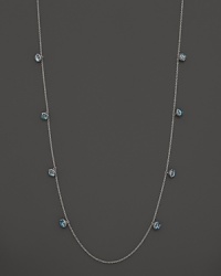 Inspired by Zen philosophy, this intricately detailed sterling silver necklace from Paul Morelli softly jingles with eight meditation bells and cabochons of blue topaz. Inspired by Zen philosophy, this intricately detailed sterling silver necklace from Paul Morelli softly jingles with eight meditation bells and cabochons of blue topaz.