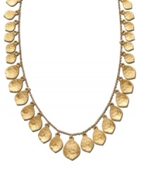 Adorn your neckline with cascading shimmery leaves. This autumn-inspired necklace from the Lauren by Ralph Lauren collection features a plethora of dangling leaf charms of varying size and texture. Crafted in gold tone mixed metal. Approximate length: 18 inches. Approximate drop: 1-1/2 inches. Adorn your neckline with cascading shimmery leaves. This autumn-inspired necklace from the Lauren by Ralph Lauren collection features a plethora of dangling leaf charms of varying size and texture. Crafted in gold tone mixed metal. Approximate length: 18 inches. Approximate drop: 1-1/2 inches.