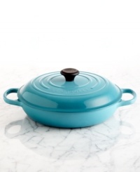 An innovative design with a flat base is the ideal space for poaching, searing, roasting, stir-frying and browning. Inspired by French braisers, this piece uses wet and dry heats to break down and tenderize even the toughest meats. Crafted of enameled cast iron, this piece distributes heat evenly and slowly and goes from oven to table with ease. Lifetime warranty. An innovative design with a flat base is the ideal space for poaching, searing, roasting, stir-frying and browning. Inspired by French braisers, this piece uses wet and dry heats to break down and tenderize even the toughest meats. Crafted of enameled cast iron, this piece distributes heat evenly and slowly and goes from oven to table with ease. Lifetime warranty.
