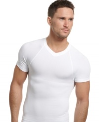 Seamless and snug for full no-show coverage, this form-fitting tee from One Flat Jack does all the work under your shirt for a sleek, slimmed down effect. Seamless and snug for full no-show coverage, this form-fitting tee from One Flat Jack does all the work under your shirt for a sleek, slimmed down effect.