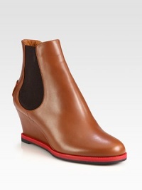 Butter-soft leather in a warm hue forms this must-have silhouette, with easy elastic panels and a contrasting sole. Self-covered wedge, 2¾ (70mm)Leather upper with side elastic panelsPull-on styleLeather liningRubber solePadded insoleMade in Italy Butter-soft leather in a warm hue forms this must-have silhouette, with easy elastic panels and a contrasting sole. Self-covered wedge, 2¾ (70mm)Leather upper with side elastic panelsPull-on styleLeather liningRubber solePadded insoleMade in Italy