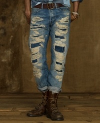 A slim-fitting jean is heavily ripped and patched for a shredded, well-worn look that pairs well with your favorite hoodie or V-neck tee. A slim-fitting jean is heavily ripped and patched for a shredded, well-worn look that pairs well with your favorite hoodie or V-neck tee.