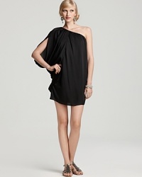 Back from the '80s, reinvigorated for today. This short, black batwing sleeve dress is loaded with drama. Step into high black heels to finish. Back from the '80s, reinvigorated for today. This short, black batwing sleeve dress is loaded with drama. Step into high black heels to finish.