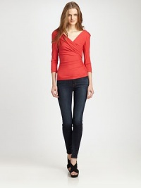 DVF's signature wrap effect adds a glam touch to this shiny, three-quarter-sleeved pullover.V-neckThree-quarter sleevesPullover styleAbout 21 from shoulder to hemViscose/LycraDry cleanImportedModel shown is 5'10 (177cm) wearing US size Small. DVF's signature wrap effect adds a glam touch to this shiny, three-quarter-sleeved pullover.V-neckThree-quarter sleevesPullover styleAbout 21 from shoulder to hemViscose/LycraDry cleanImportedModel shown is 5'10 (177cm) wearing US size Small.