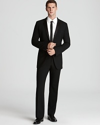 Appointed with classic details, this fine tuxedo suit makes a strong impression at all your black tie affairs. Take the dance floor with authority or raise your glass and make a toast with the quiet confidence that comes from looking sharp. Appointed with classic details, this fine tuxedo suit makes a strong impression at all your black tie affairs. Take the dance floor with authority or raise your glass and make a toast with the quiet confidence that comes from looking sharp.