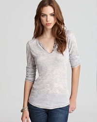 Edgy burnout details enhance this casual Michael Stars Tee--a hot little henley for a well-lived day in denim. Edgy burnout details enhance this casual Michael Stars Tee--a hot little henley for a well-lived day in denim.