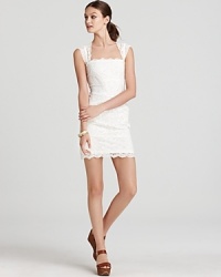 At once daring and demure, this curve-defining Nicole Miller dress is fashioned in delicate lace. At once daring and demure, this curve-defining Nicole Miller dress is fashioned in delicate lace.
