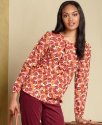 Let style bloom in Tommy Hilfiger's floral-print top, complete with a crisp ruffle at the chest for a feminine touch.