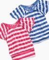 Keep it light. With allover stripes and flutter sleeves, this top from Guess is the perfect look for the summer sun.