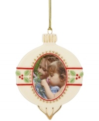 In the shape of a classic Christmas ball, this ornament from Lenox lets you add a personal touch to your tree with a picture frame center. With gold hanging thread. In the shape of a classic Christmas ball, this ornament from Lenox lets you add a personal touch to your tree with a picture frame center. With gold hanging thread.