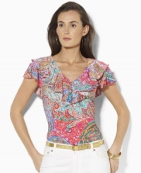 A chic V-neck jersey top is trimmed with a flourish of ruffles at the neckline and delicate flutter sleeves, from Lauren by Ralph Lauren. A chic V-neck jersey top is trimmed with a flourish of ruffles at the neckline and delicate flutter sleeves, from Lauren by Ralph Lauren.