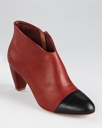 A modern update on a timeless classic, Loeffler Randall's well-heeled Nanette booties showcase a cap-toed silhouette in the softest leather. A modern update on a timeless classic, Loeffler Randall's well-heeled Nanette booties showcase a cap-toed silhouette in the softest leather.
