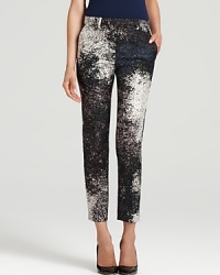 Pack a major sartorial punch in cropped Halston Heritage pants emboldened by graphic bursts of print. Pack a major sartorial punch in cropped Halston Heritage pants emboldened by graphic bursts of print.