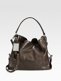 A roomy leather carryall in a classic shape with a versatile detachable strap.Top handles, 9½ dropDetachable adjustable shoulder strap, 21½-22½ dropMagnetic snap closureThree inner compartmentsTwo inside zip pocketTwo inside open pocketsCotton lining14½W X 11H X 6DMade in Italy A roomy leather carryall in a classic shape with a versatile detachable strap.Top handles, 9½ dropDetachable adjustable shoulder strap, 21½-22½ dropMagnetic snap closureThree inner compartmentsTwo inside zip pocketTwo inside open pocketsCotton lining14½W X 11H X 6DMade in Italy