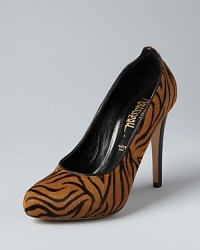 Be a tigress: Jerome C. Rousseau puts his stamp on the exotics trend in tiger-printed haircalf, in pumps with animal appeal. Be a tigress: Jerome C. Rousseau puts his stamp on the exotics trend in tiger-printed haircalf, in pumps with animal appeal.