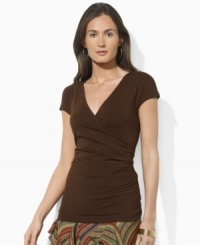 Delicate ruching at the waistline creates a flattering faux-wrap silhouette, rendered in sleek stretch jersey for comfort and style, from Lauren by Ralph Lauren. Delicate ruching at the waistline creates a flattering faux-wrap silhouette, rendered in sleek stretch jersey for comfort and style, from Lauren by Ralph Lauren.