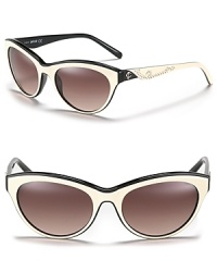 Western-inspired cat eye sunglasses with contrast interior and studded sides. Western-inspired cat eye sunglasses with contrast interior and studded sides.