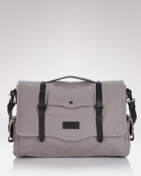 Trimmed with handsome contrast leather and featuring excellent organizational pockets inside and out, this canvas messenger bag from Ben Minkoff balances form and function perfectly. Trimmed with handsome contrast leather and featuring excellent organizational pockets inside and out, this canvas messenger bag from Ben Minkoff balances form and function perfectly.