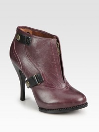 Sawtooth edging lines this shiny leather design with contrasting straps, easy front zip and stacked heel. Stacked heel, 4¼ (110mm)Shiny leather upperFront zip and leather straps with snap closuresLeather lining and solePadded insoleImported Sawtooth edging lines this shiny leather design with contrasting straps, easy front zip and stacked heel. Stacked heel, 4¼ (110mm)Shiny leather upperFront zip and leather straps with snap closuresLeather lining and solePadded insoleImported