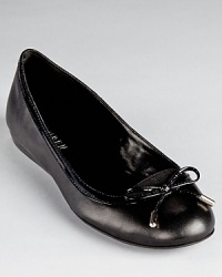 Lauren Ralph Lauren's classic Miram flats slip-on-and-go with the addition of elastic goring at the bow-wrapped toe. Lauren Ralph Lauren's classic Miram flats slip-on-and-go with the addition of elastic goring at the bow-wrapped toe.