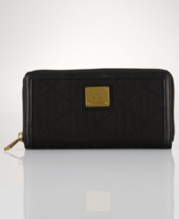 A Deco-inspired logo print and sleek, sophisticated silhouette make this Lauren Ralph Lauren zip-around wallet an infallibly stylish staple for toting around the daily essentials. A Deco-inspired logo print and sleek, sophisticated silhouette make this Lauren Ralph Lauren zip-around wallet an infallibly stylish staple for toting around the daily essentials.