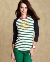 Channel varsity style in Tommy Hilfiger's raglan-sleeve tee, complete with stripes and a velvet logo at the chest. Channel varsity style in Tommy Hilfiger's raglan-sleeve tee, complete with stripes and a velvet logo at the chest.