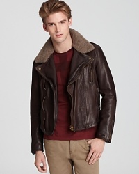 A forever classic, the leather bomber jacket with a shearling collar, expressively masculine and ruggedly refined, with distinctive designer appeal from Burberry Brit. A forever classic, the leather bomber jacket with a shearling collar, expressively masculine and ruggedly refined, with distinctive designer appeal from Burberry Brit.