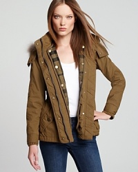Melding fashion with function, a utilitarian Burberry Brit anorak features a detachable quilted liner and a zip-on hood for style suited for the elements. Plush fur trim snaps onto the hood for a touch of exotic edge. Melding fashion with function, a utilitarian Burberry Brit anorak features a detachable quilted liner and a zip-on hood for style suited for the elements. Plush fur trim snaps onto the hood for a touch of exotic edge.