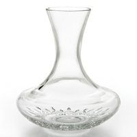 Purposefully designed to aerate wines prior to serving, this crystal accent piece enhances both white and red wines. Decanting allows wine to attain clarity and color while enabling the flavor to develop. The Decanting Carafe is shaped to achieve most favorable results from the decanting process. The long, slender neck enables the wine to run unreservedly down the sides, while the flared base permits air exposure to a larger surface area of wine. Designed to add casual elegance to every day use. 60 oz. (or the contents of two standard 750-ml. bottles)