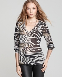 Tap into your animal instincts and one of the top trends of the season with this sheer and silky soft PJK Patterson J. Kincaid top that features a bold zebra print. Tap into your animal instincts and one of the top trends of the season with this sheer and silky soft PJK Patterson J. Kincaid top that features a bold zebra print.