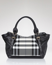A bold black and white check panel lends statement style to this go-anywhere tote from Burberry. A bold black and white check panel lends statement style to this go-anywhere tote from Burberry.