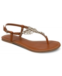 Dripping with jewels. The sparkling accents on Carlos by Carlos Santana's Flora flat sandals are like icing on a (really, really cute) cake. Dripping with jewels. The sparkling accents on Carlos by Carlos Santana's Flora flat sandals are like icing on a (really, really cute) cake.