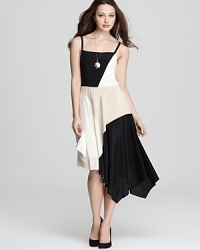 Take two trends for a twirl with this DKNY dress. Color blocking meets an asymmetric hem for of-the-moment style. Take two trends for a twirl with this DKNY dress. Color blocking meets an asymmetric hem for of-the-moment style.