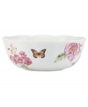 Grow your garden. The Butterfly Meadow Bloom serving bowl from Lenox features the sturdy, scalloped porcelain of original Butterfly Meadow dinnerware but with fresh pink and violet blossoms.