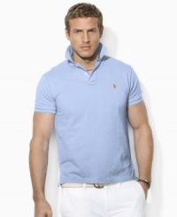 Cut in a trim, modern silhouette, a short-sleeved polo shirt is rendered in breathable cotton mesh with signature embroidery for iconic style Cut in a trim, modern silhouette, a short-sleeved polo shirt is rendered in breathable cotton mesh with signature embroidery for iconic style