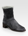 This versatile suede design with faux fur trim and lining can be folded over for a short silhouette. Stacked heel, 1¾ (45mm)Suede upper with faux fur trimPull-on styleFaux fur liningRubber solePadded insoleImported