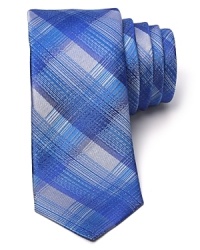 HUGO furnishes this skinny silk tie with an artful brushstroke check for an innovative take on classic plaid. HUGO furnishes this skinny silk tie with an artful brushstroke check for an innovative take on classic plaid.