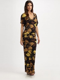 A gorgeous floral print with a curve-hugging maxi-dress fit creating a stunning and elongating coverup. V-neckShort sleevesPull-on style87% nylon/13% spandexHand washImported A gorgeous floral print with a curve-hugging maxi-dress fit creating a stunning and elongating coverup. V-neckShort sleevesPull-on style87% nylon/13% spandexHand washImported