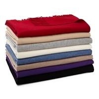 An ultra-soft and luxurious cashmere throw adds warmth and elegance to a room.