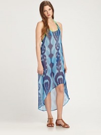 This voluminous, semi-sheer style features a bright ikat print and an asymmetrical hem. ScoopneckSleevelessRacerbackContrast pipingAsymmetrical hemAbout 50 from shoulder to hemPolyesterHand washMade in USA of imported fabrics This voluminous, semi-sheer style features a bright ikat print and an asymmetrical hem. ScoopneckSleevelessRacerbackContrast pipingAsymmetrical hemAbout 50 from shoulder to hemPolyesterHand washMade in USA of imported fabrics