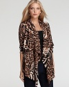 Crisp cheetah print enlivens the fluid silhouette of a draped Karen Kane Plus jacket. Slip the statement piece over everyday staples for an instant fashion lift.