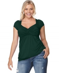 Soprano upgrades the cap sleeved plus size top with an enhancing crisscross front and slimming empire waist. Soprano upgrades the cap sleeved plus size top with an enhancing crisscross front and slimming empire waist.