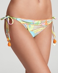 Trina Turk's tropical print bikini begs for a sun bleached day of sand and surf. Play up the pastel color palette with a sheer black sarong.