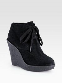 On-trend silhouette of buttery Italian suede, lifted by a rubber wedge and platform. Rubber wedge, 4¾ (120mm)Rubber platform, 1 (25mm)Compares to a 3¾ heel (95mm)Suede upperShearling liningRubber solePadded insoleMade in Italy On-trend silhouette of buttery Italian suede, lifted by a rubber wedge and platform. Rubber wedge, 4¾ (120mm)Rubber platform, 1 (25mm)Compares to a 3¾ heel (95mm)Suede upperShearling liningRubber solePadded insoleMade in Italy
