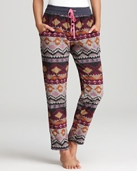 Kensie updates printed pajama pants with a soft, cozy microfleece that will take you through the winter. Kensie updates printed pajama pants with a soft, cozy microfleece that will take you through the winter.