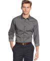 The classics keep getting better. Slip into a slim-fitted dobby shirt by Calvin Klein for a thoroughly modern statement.